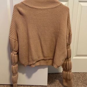 Women’s crop mock neck balloon sleeve tan sweater.